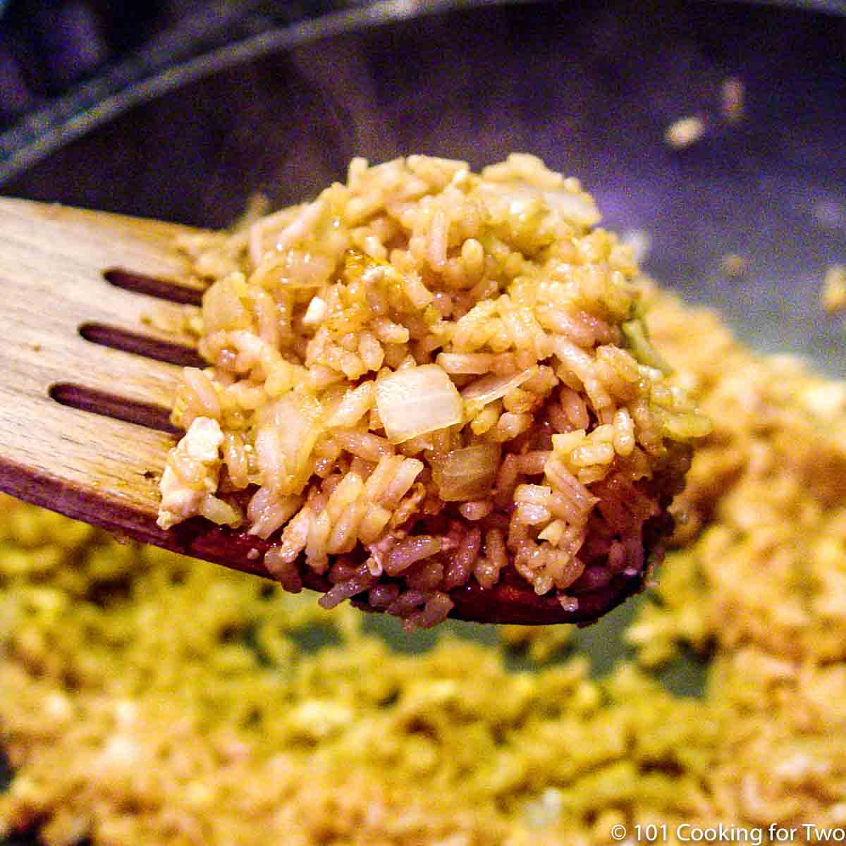 fried rice on a spatula over the pan.
