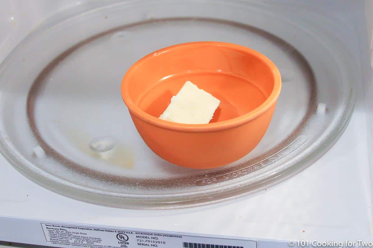 melting butter in a small bowl in a microwave.