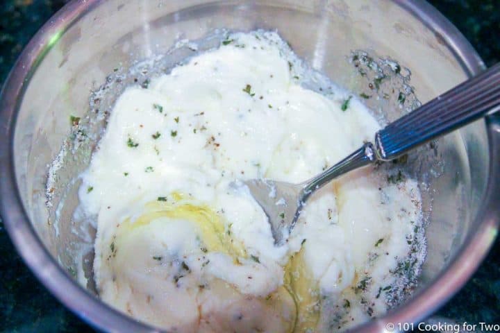 mixing ricotta cheese with an egg