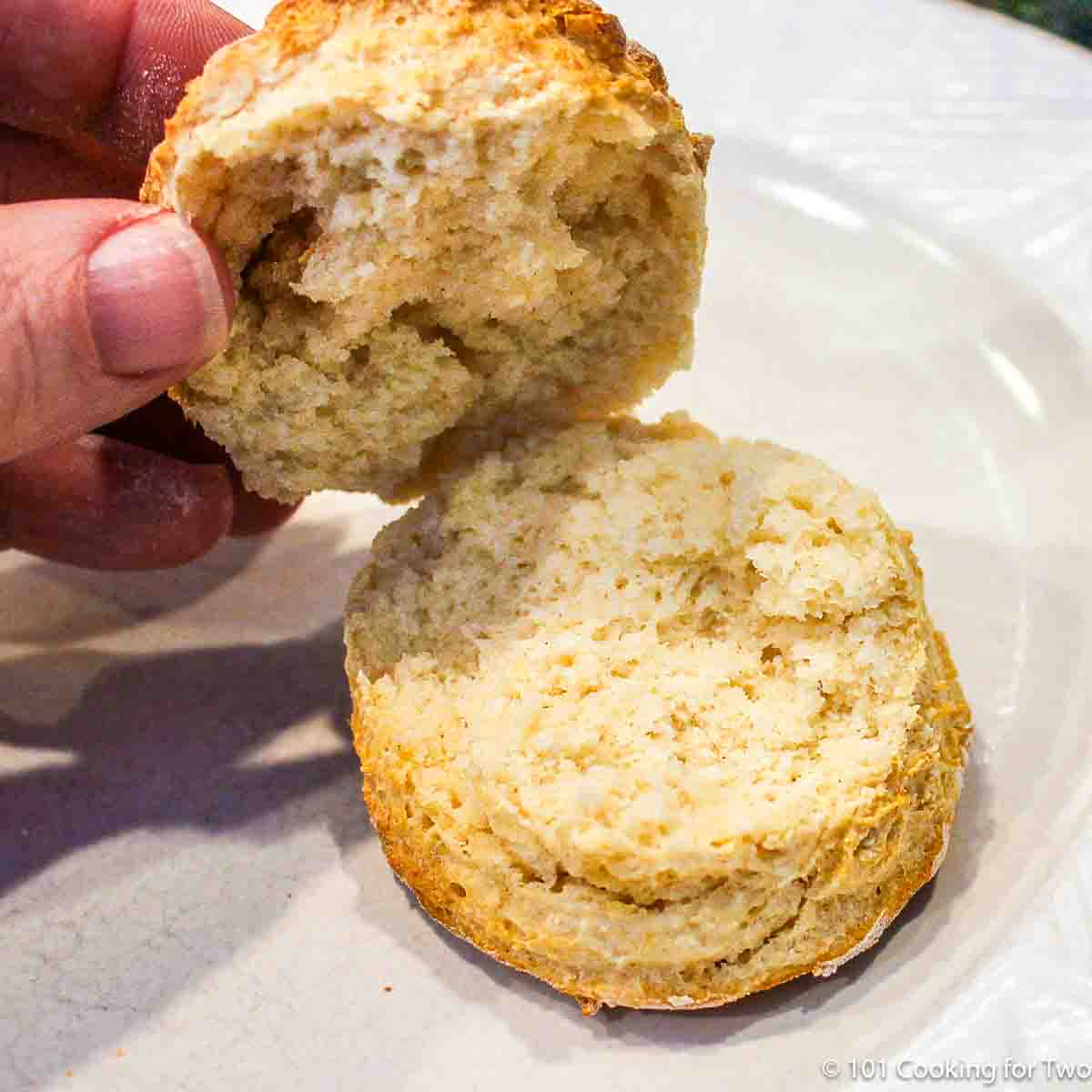 open biscuit on a white plate