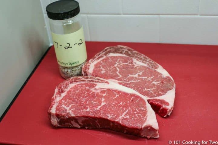 ribeye steaks with seasoning