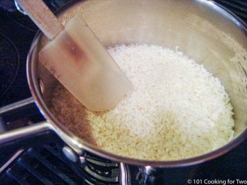 uncooked rice in a large frying pan
