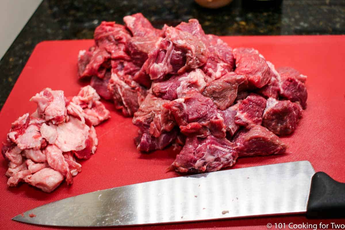a raw chuck roast trimmed and cubed