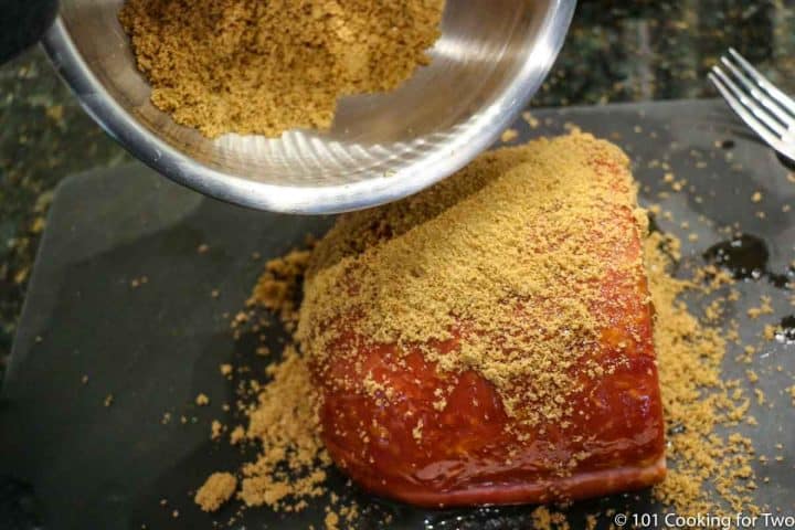 coating the ham with the brown sugar mixture