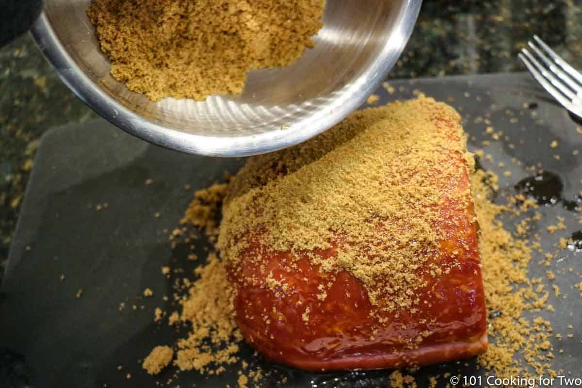 coating the ham with the brown sugar mixture.