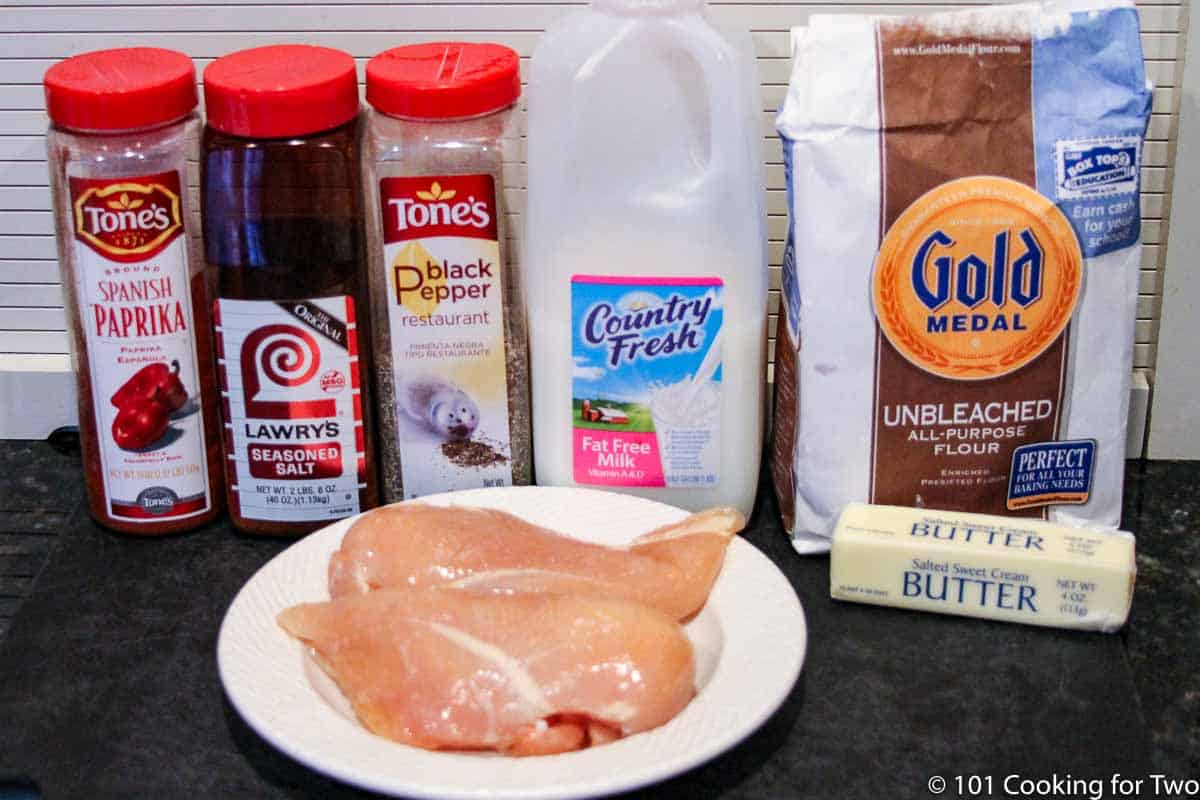 raw chicken breasts with flour and seasonings