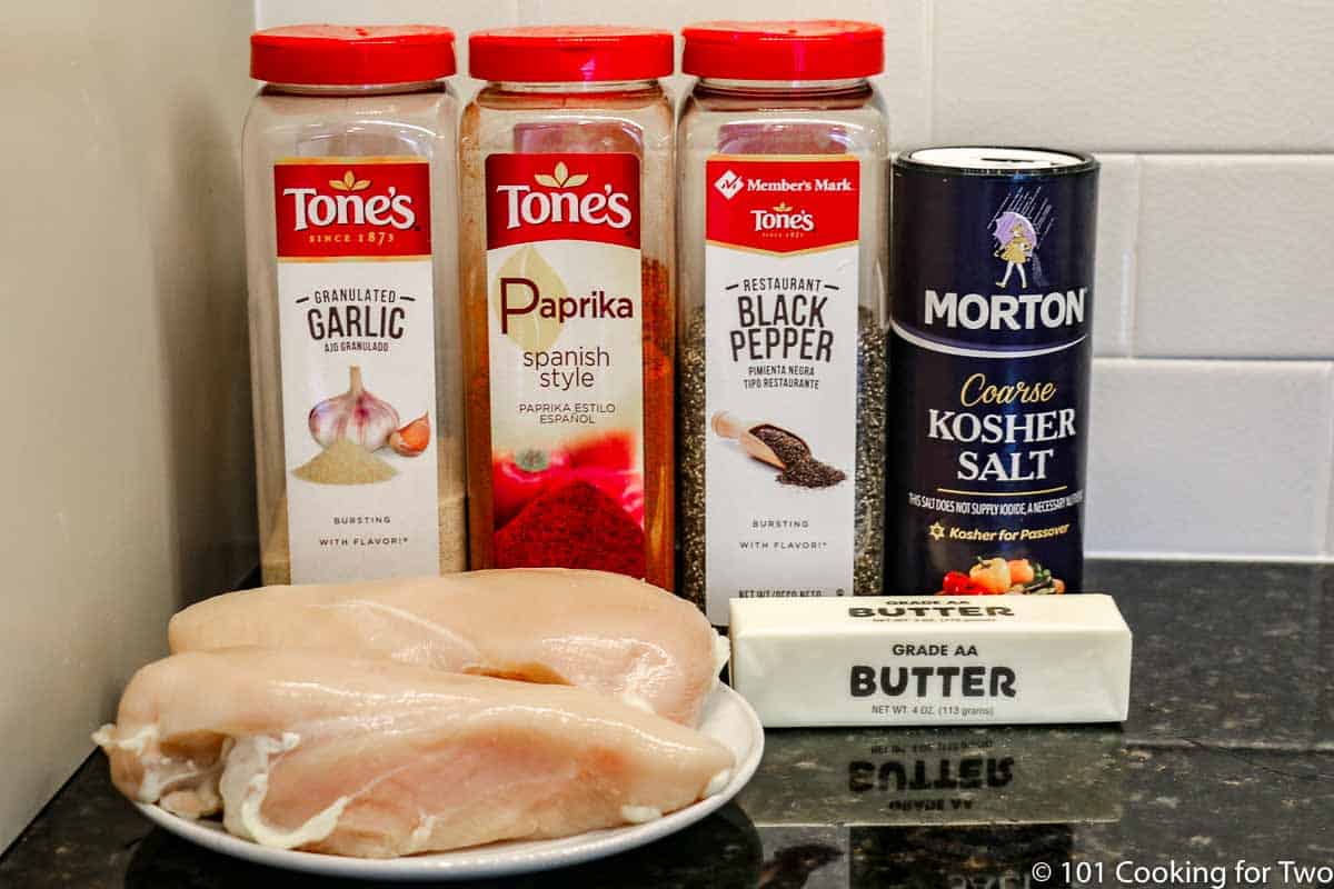 raw chicken with spices and butter