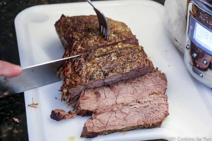 slicing the beef roast into slices