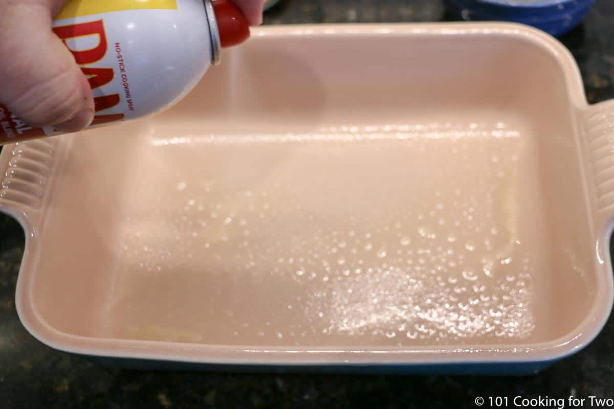 spraying a baking dish with PAM