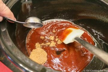 adding brown sugar to sauce in the crock pot