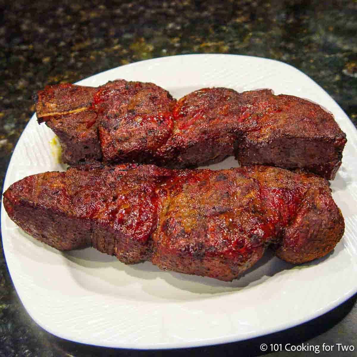 BBQ bone-in country pork ribs on a plate.