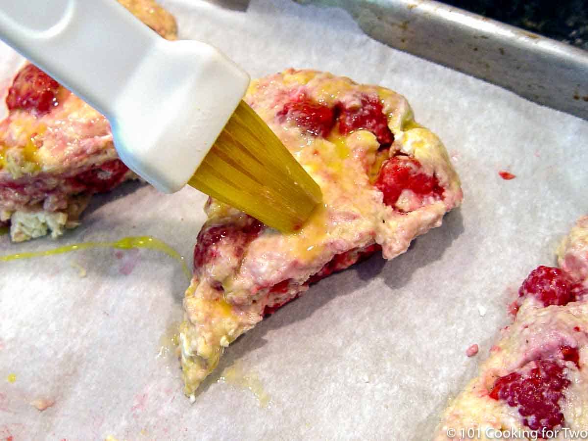brushing the raw scone with an egg wash