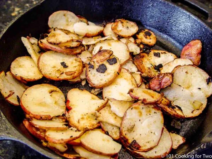 grilled potatoe slices in a cast iron pan