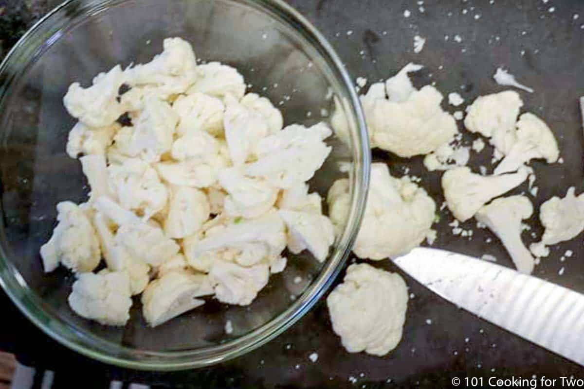 trimmed cauliflower on a black board