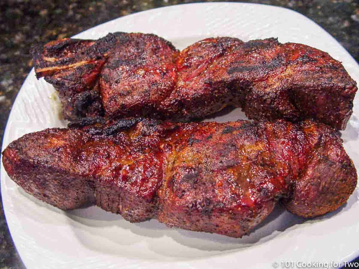 two country style ribs ona white plate