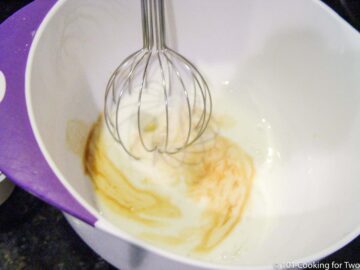 whipping egg with other wet ingredient in a medium bowl