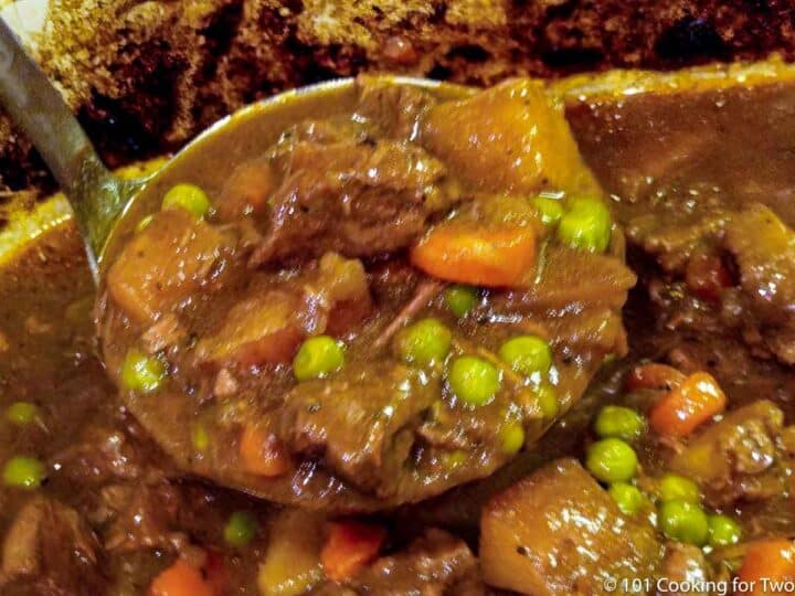 beef stew in a ladel with the crock pot