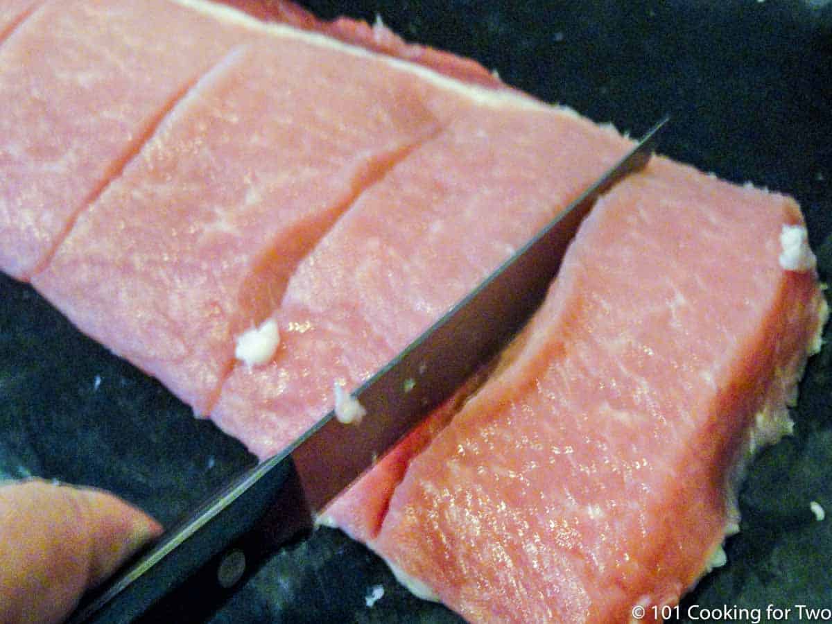 deepening cuts in boneless pork ribs.