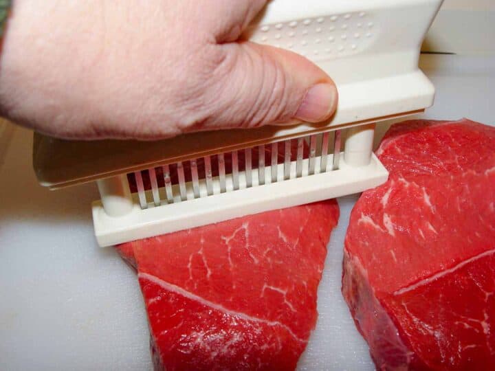 mechanically tenderizing sirloin steaks.