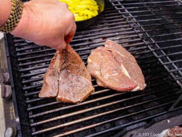 sirloin steaks on the grill over direct heat.