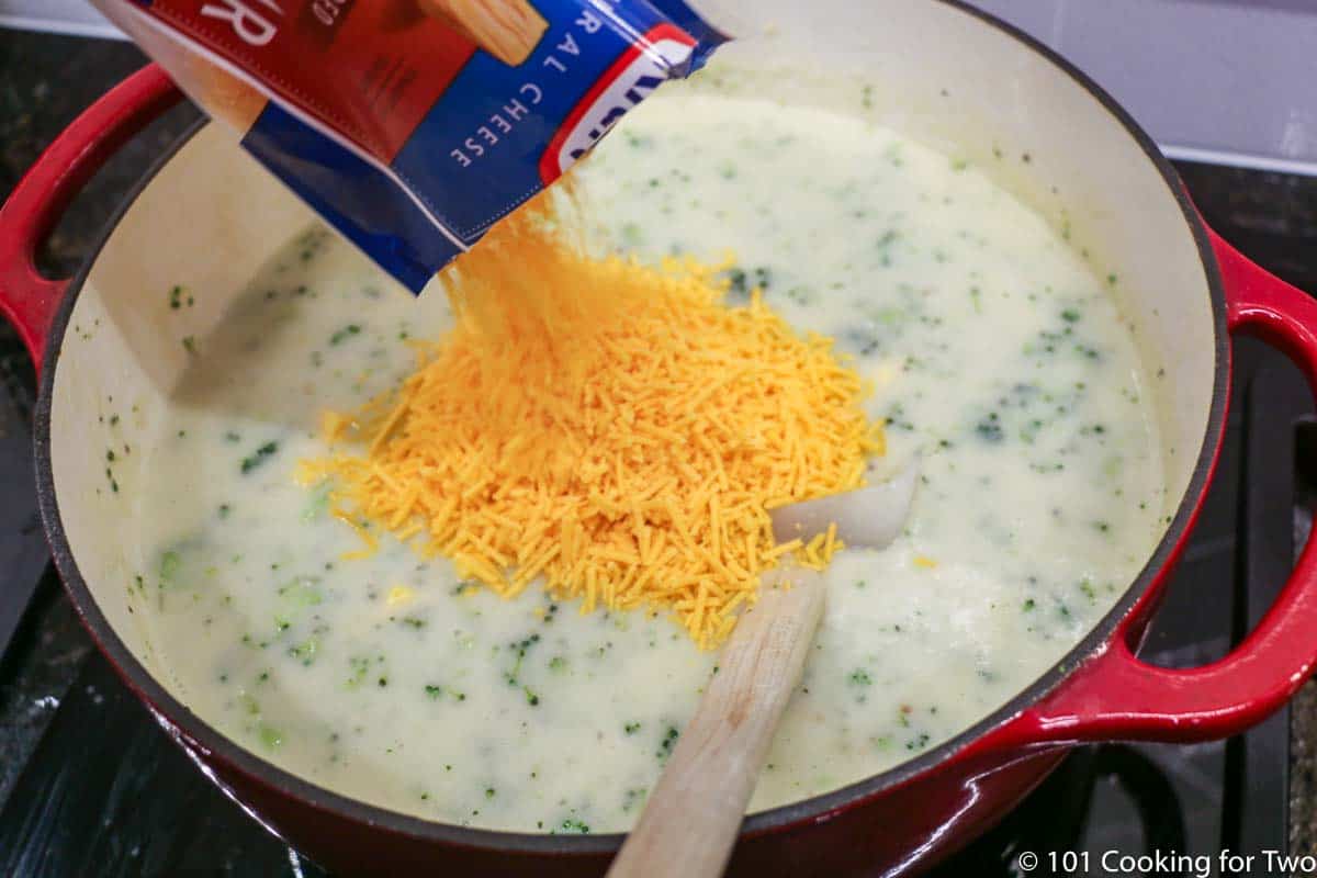 adding cheese to soup