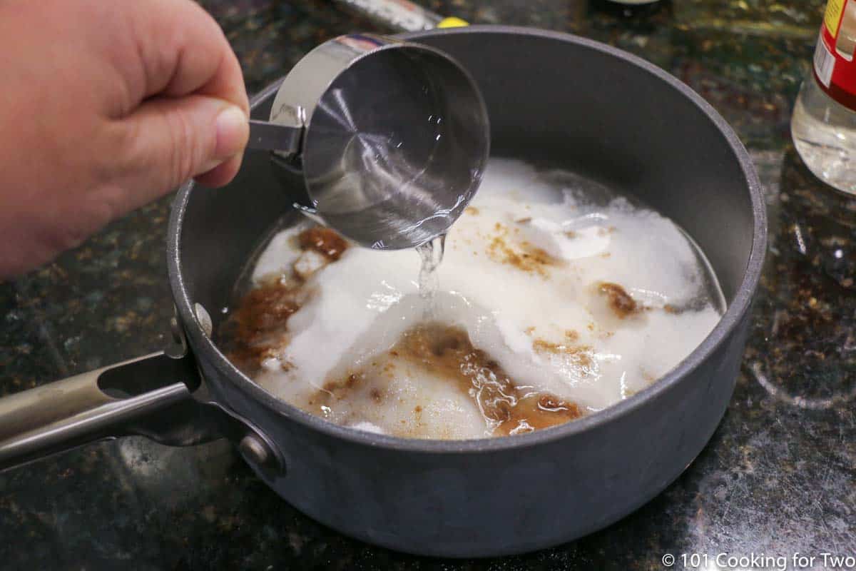 adding corn syrup to pan with other ingredients.