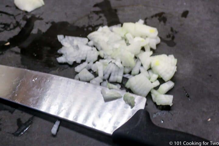 chopped onion on black board