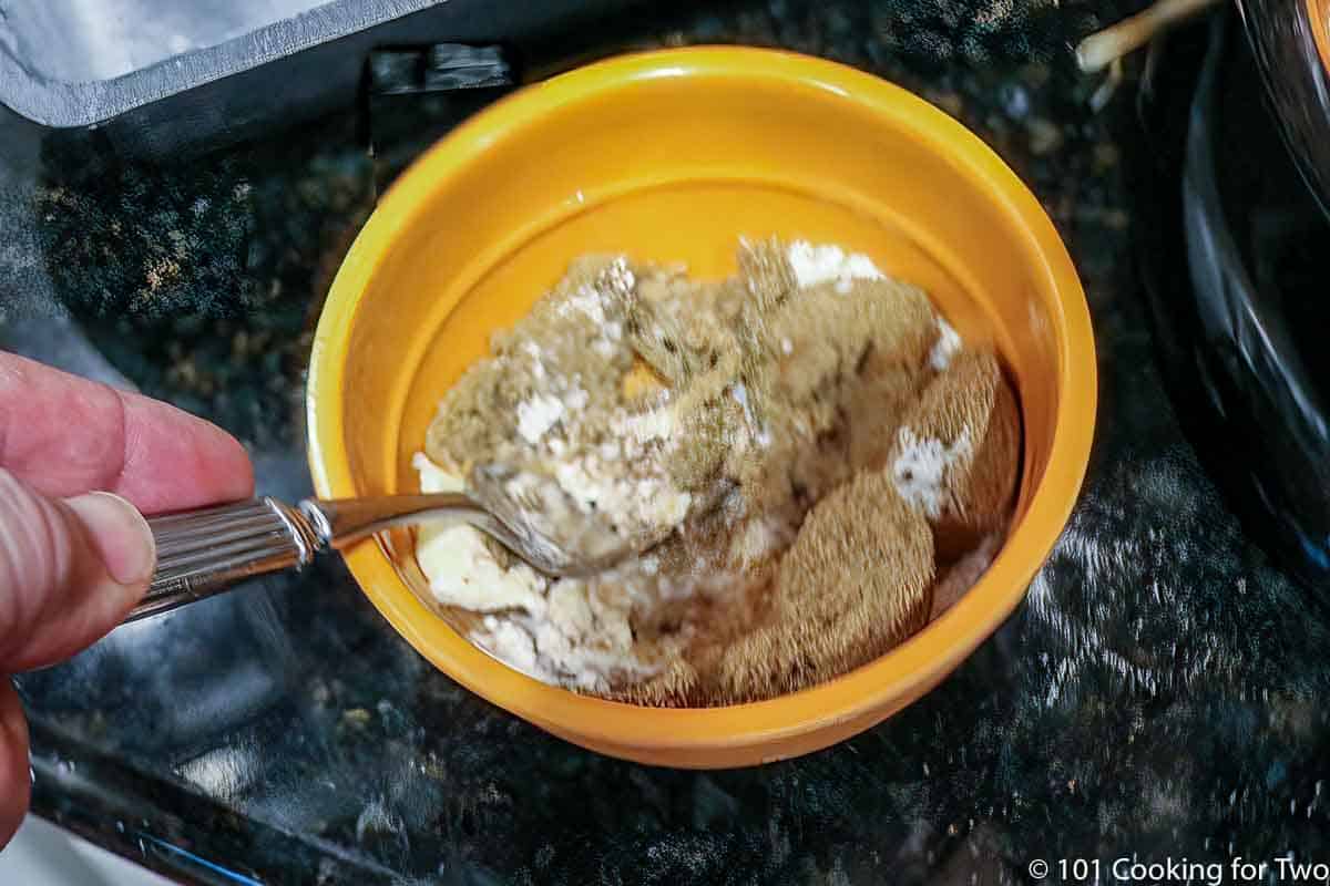 mixing topping in a small bowl.