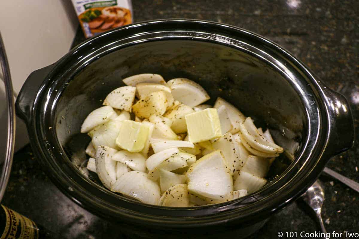 onions with butter in a crock pot
