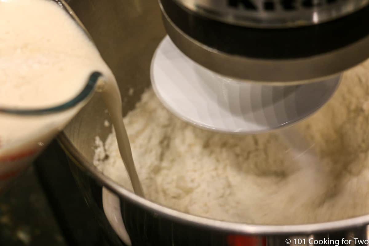adding yeast to the stand mixer.