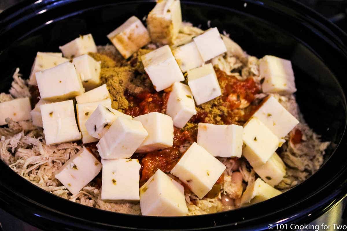 beans with chicken and cheese in a crock pot.