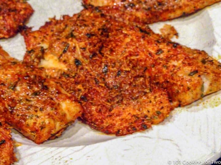 crusted tilapia on a white plate