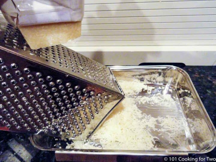 grating fresh Parmesan cheese