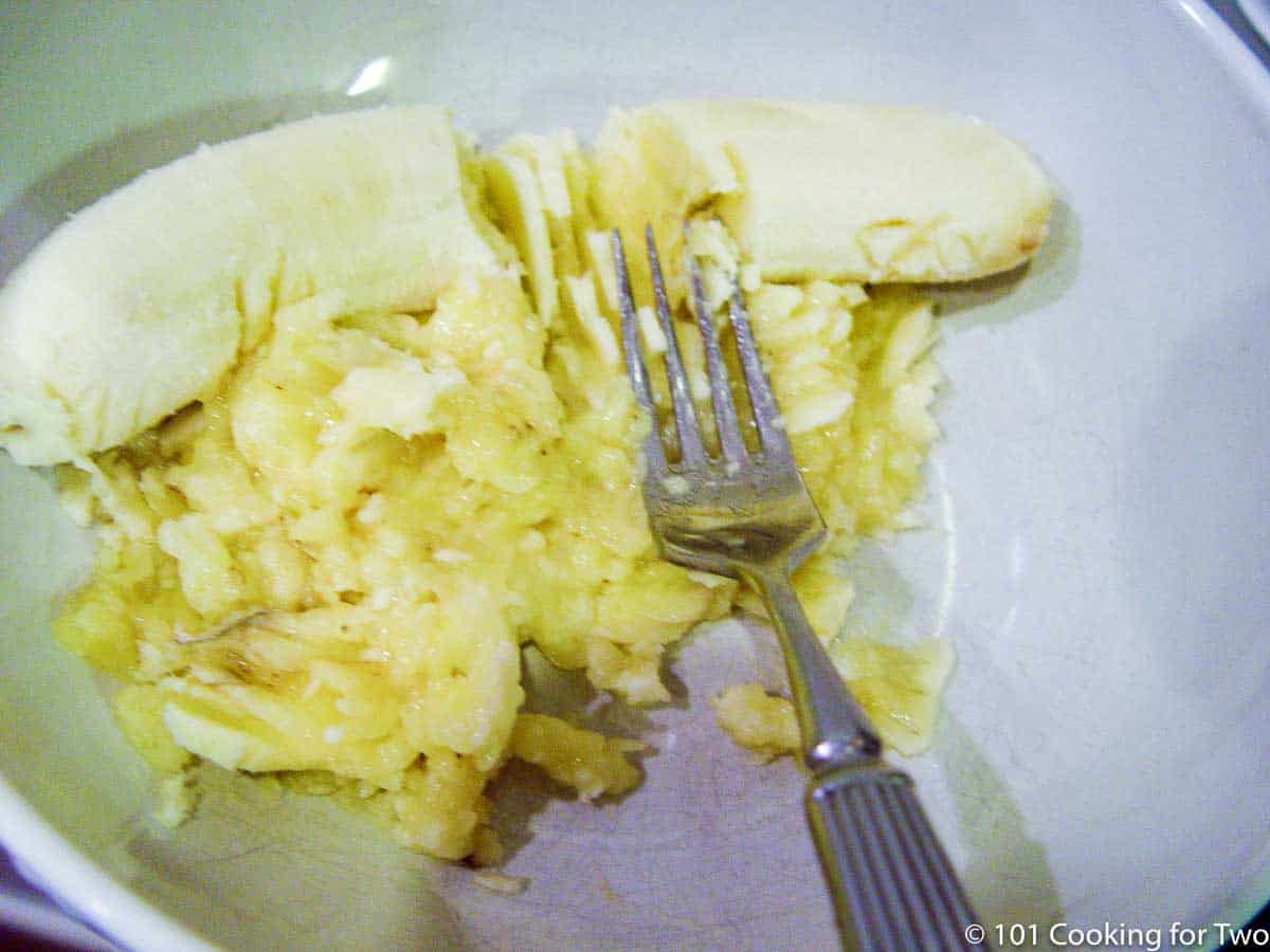 mashing bananas with a fork.