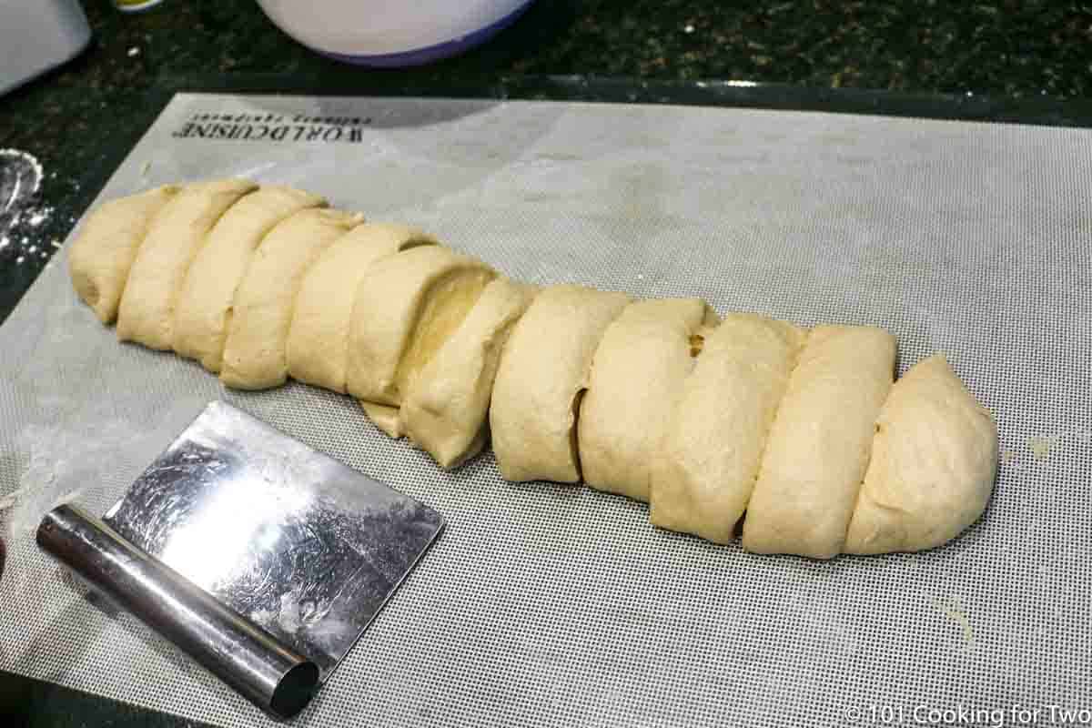 the dough in a roll and cut into 12 pieces.