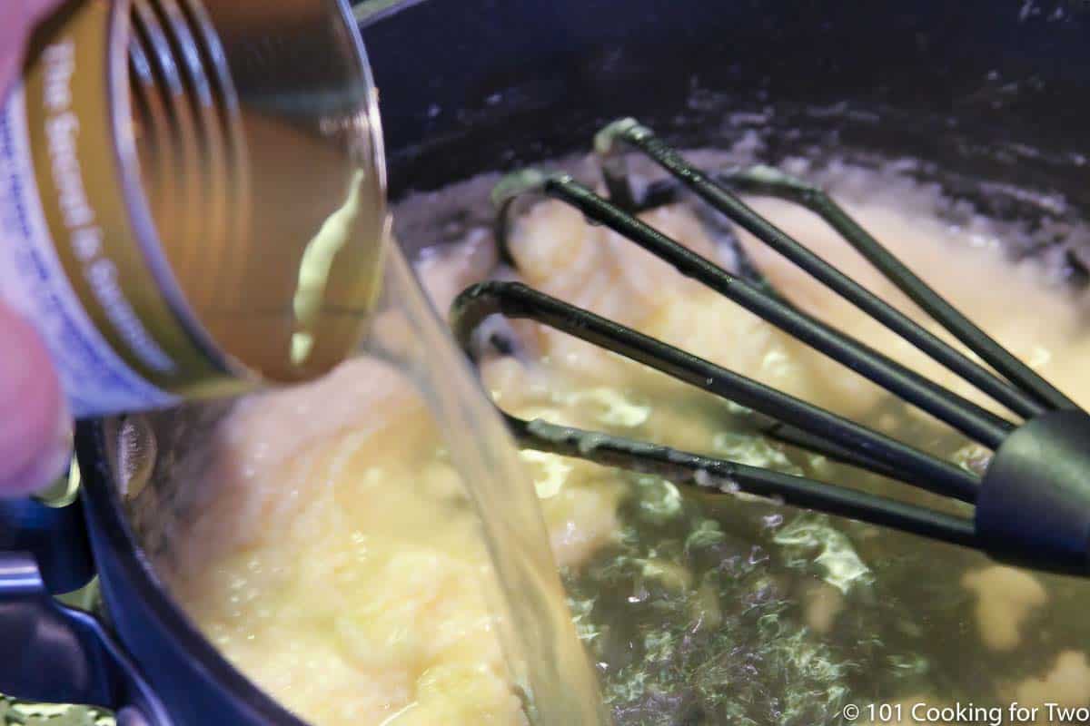 adding broth into the roux