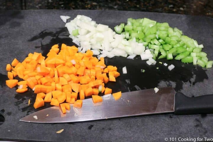 chopped vegetables on a black board