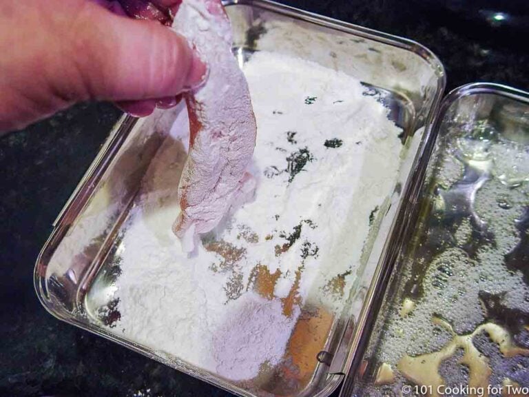 dipping chicken tender in flour