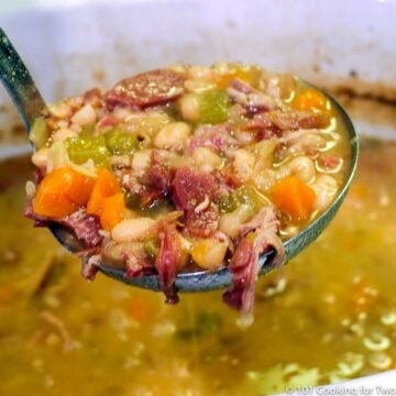 ham and bean soup in a ladel