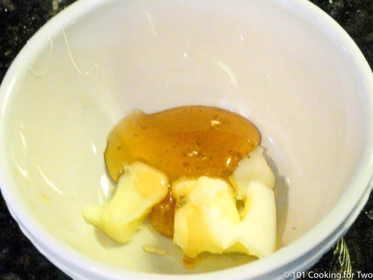 honey and butter in a white bowl