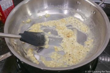 mixing a roux in a frying pan