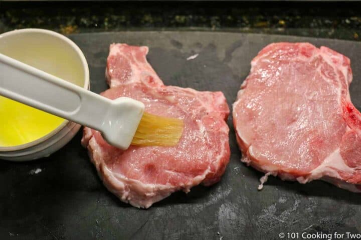brushing pork chops with melted butter