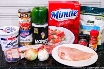 chicken and sausage with ingredients for jambalaya