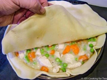 covering the filling with the second crust