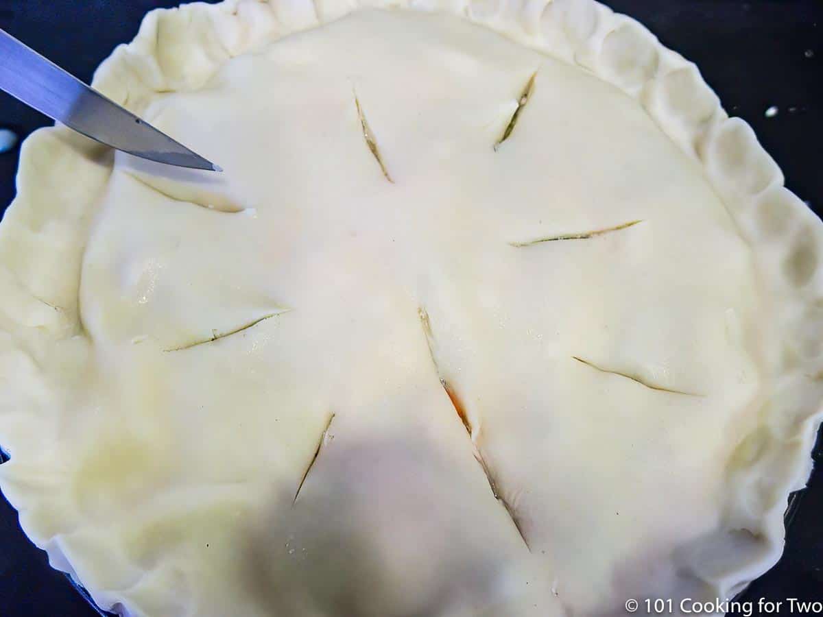 cutting vents into the top pie crust