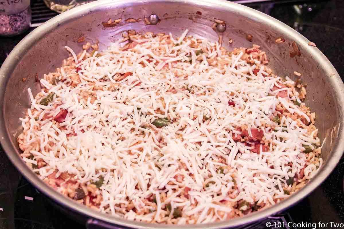 jambalaya topped with cheese ready for the oven