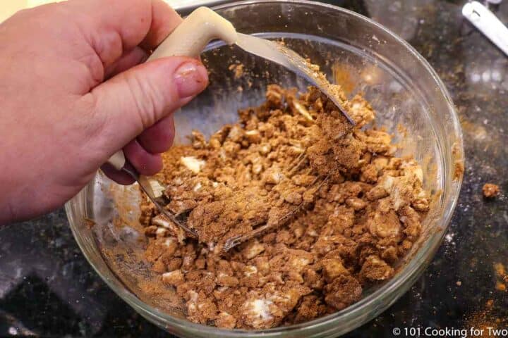 mixing topping for cake in a bowl