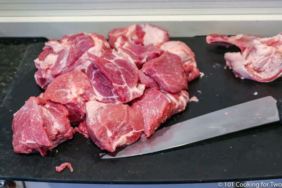 pork butt cut into cubes for carnitas.