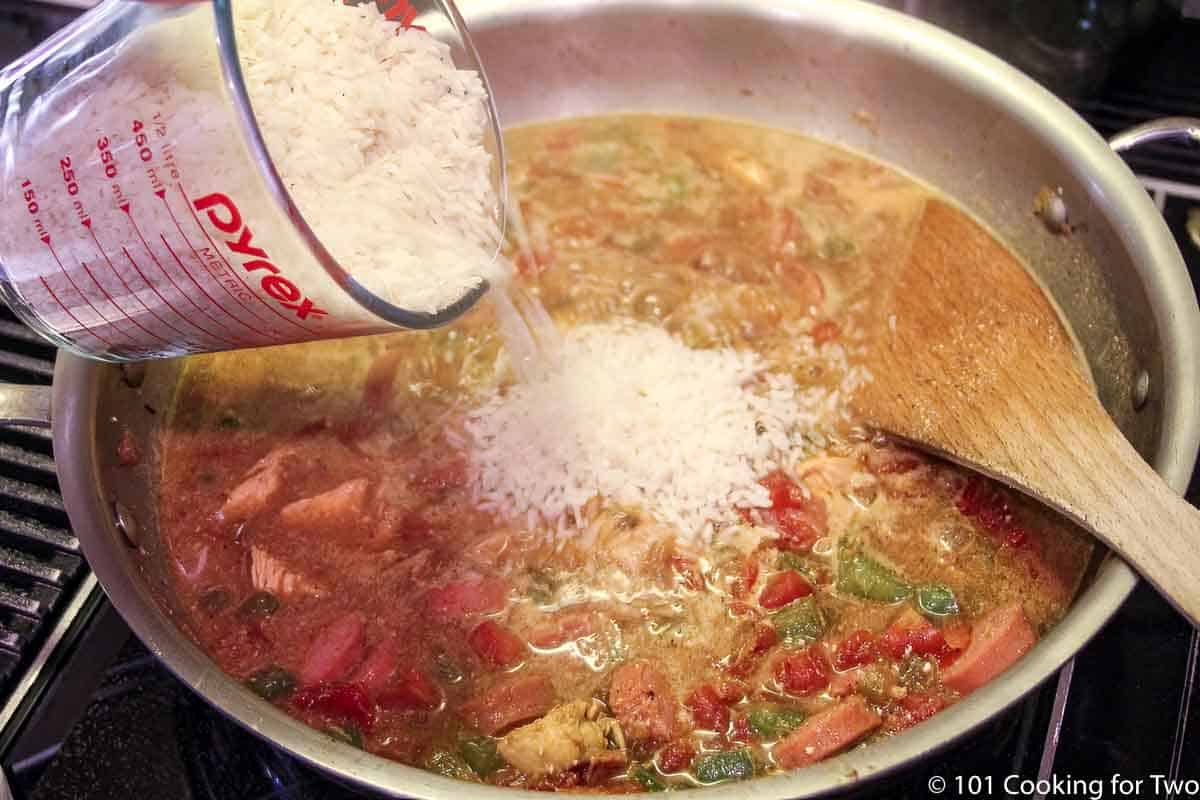 pouring rice into the pan