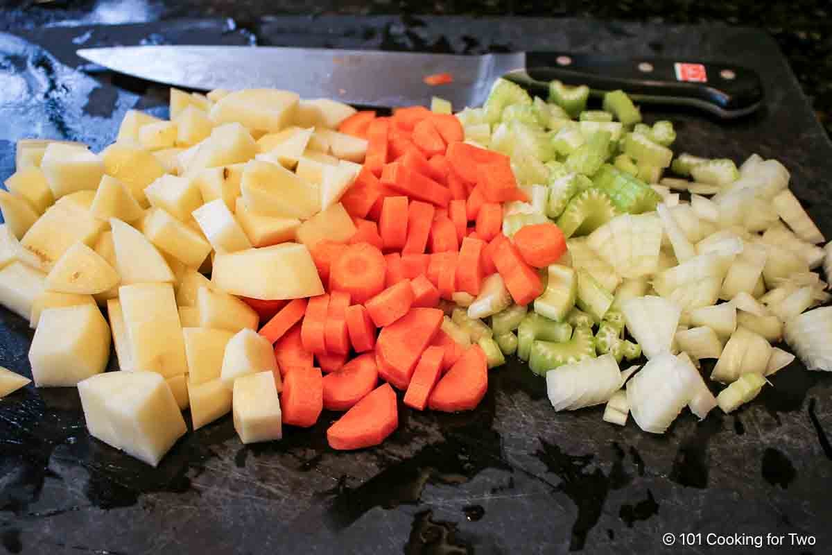 Prepared veggies on a black board.